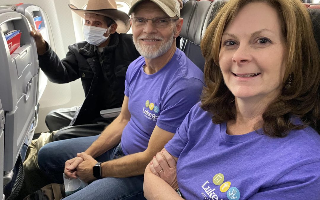 Team members Eric and Elizabeth on the airplane ready for takeoff